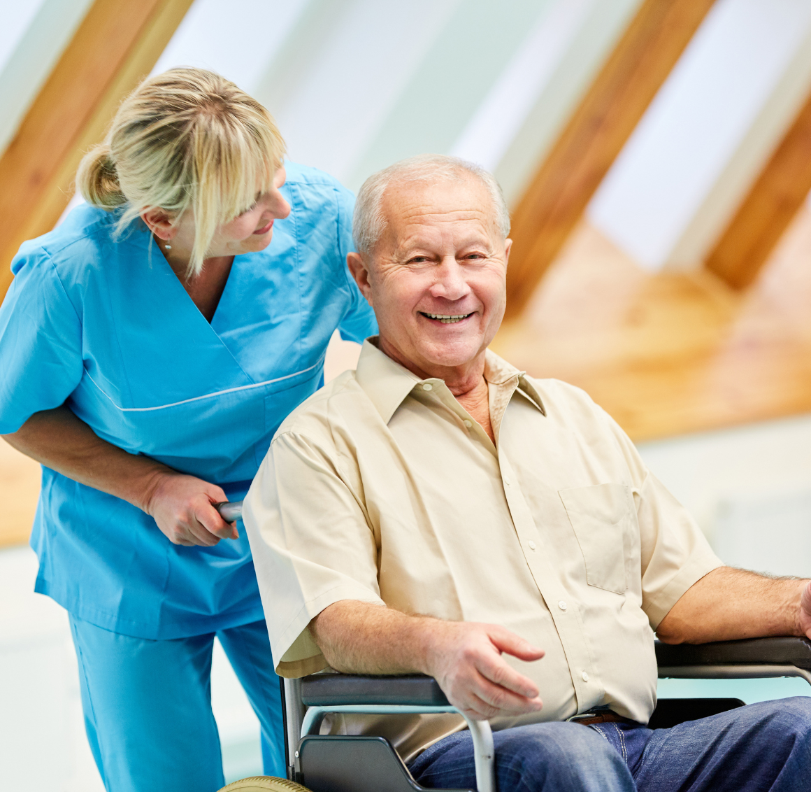 elderly man in wheelchair receiving care